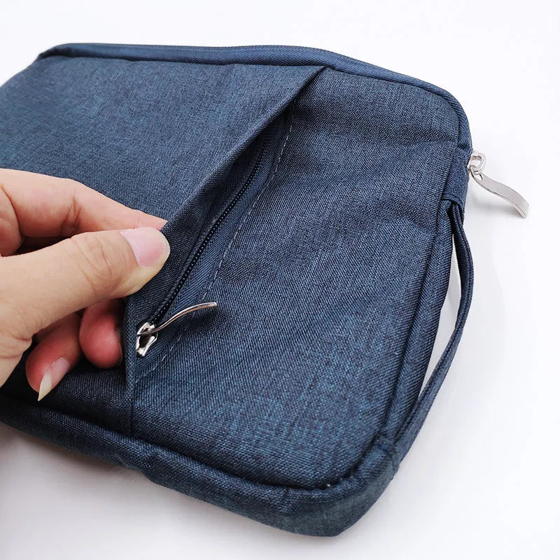 Simple grey canvas notebook sleeve case for a 12.9-inch tablet, showing padded interior.