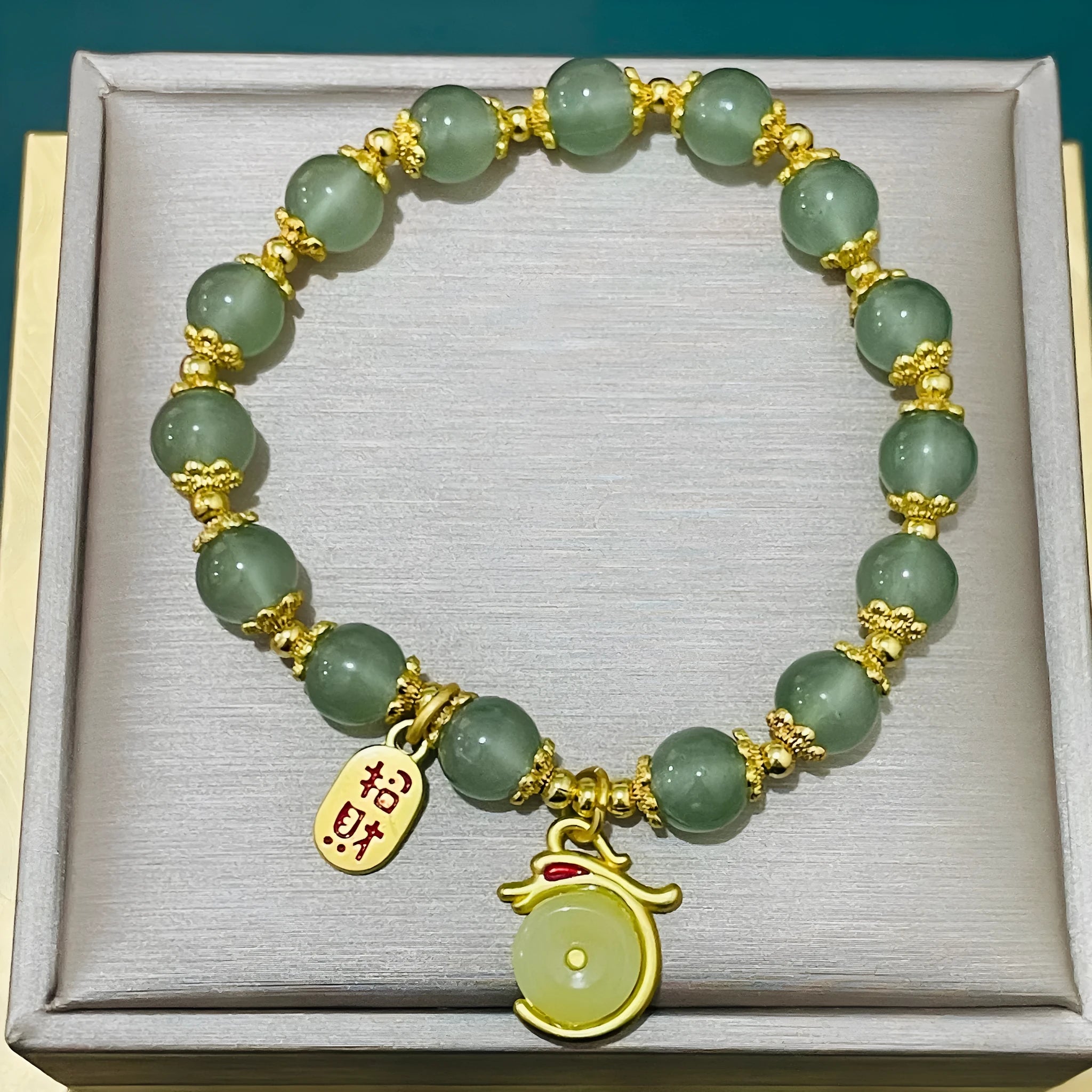 Handmade unisex glass beaded bracelet with rabbit charm on elastic cord.