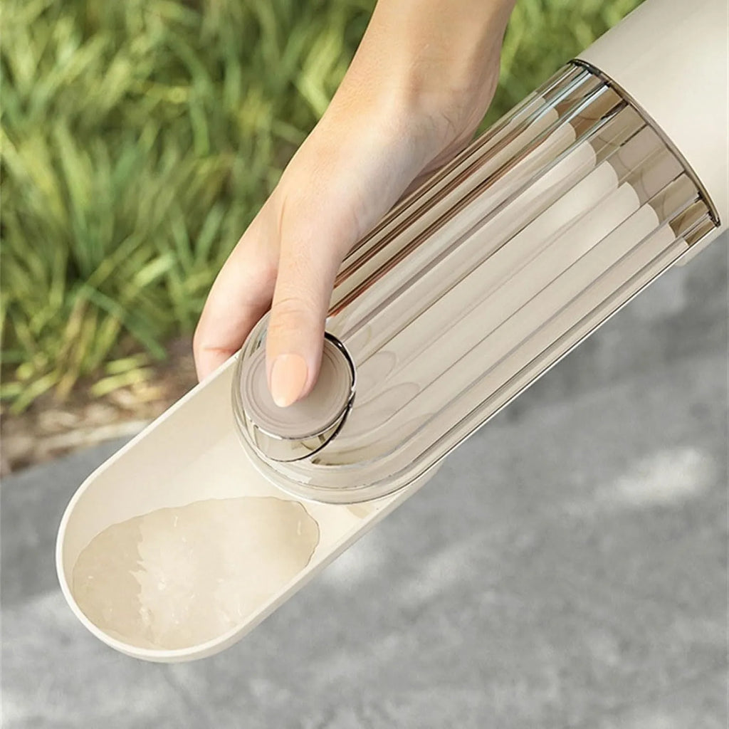 Foldable dog water bottle with food dispenser in beige or green colours for outdoor walking and hiking