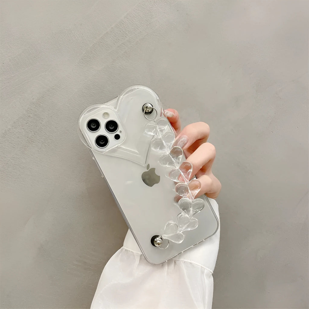 Clear iPhone case with a red love heart and chain design on the back