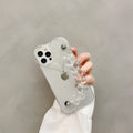 Clear iPhone case with a red love heart and chain design on the back