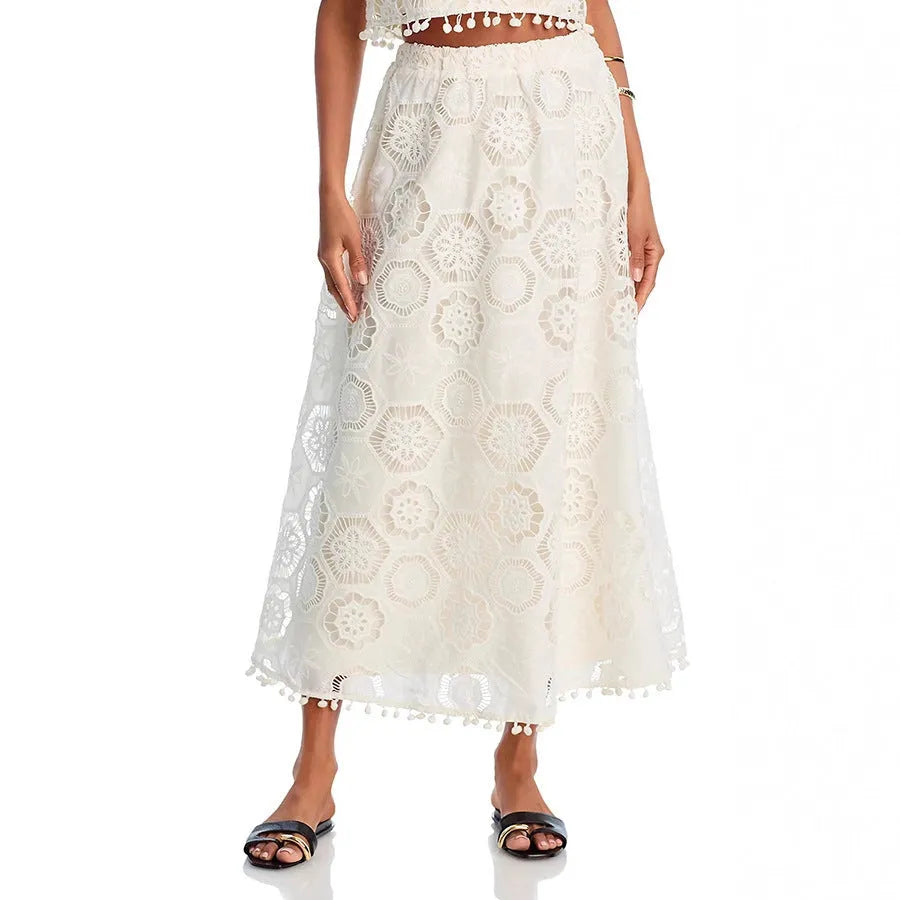 Literary Trends white women's suit with embroidered detail on sleeveless top and long skirt