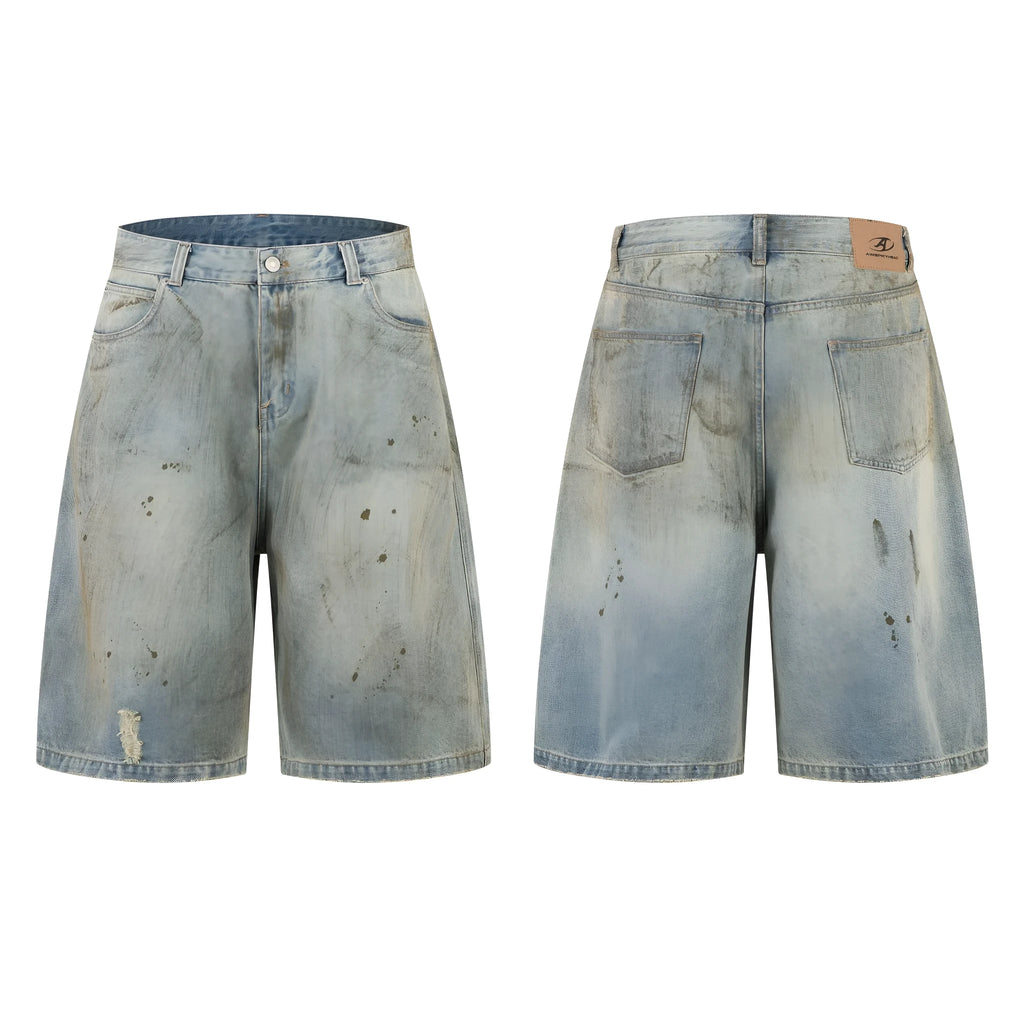 Blue washed straight leg denim trousers showing mid-length cut and zipper fly detail