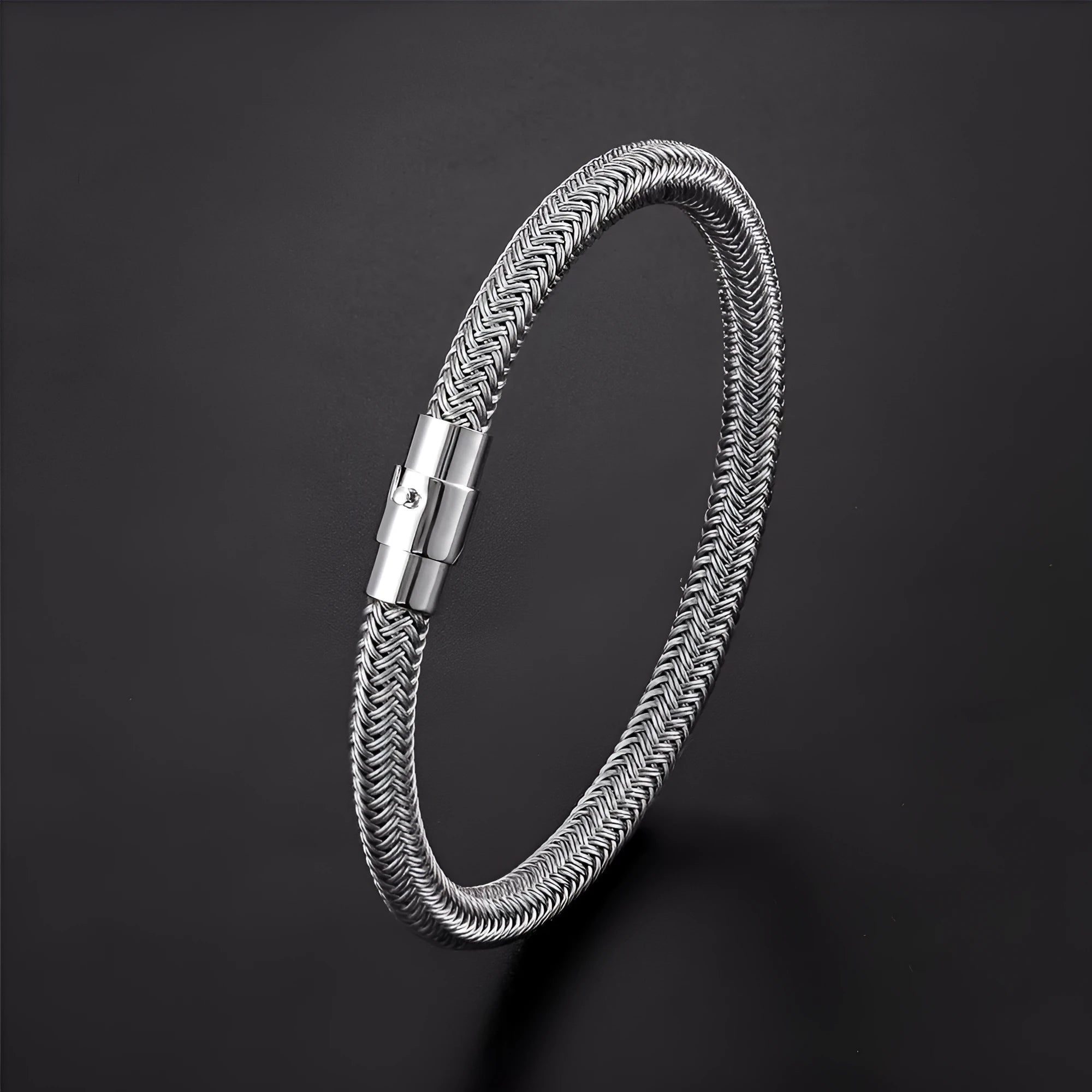 Geometric titanium steel wire bracelet with a magnetic clasp on a wrist, shown in a silver tone.