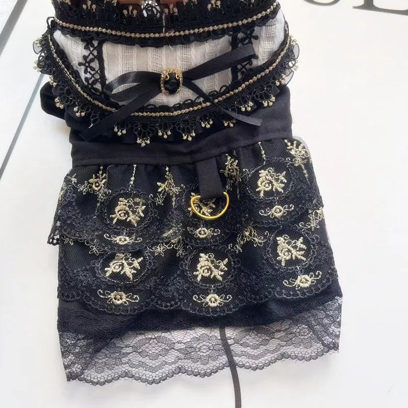 Golden gothic-style layered skirt for a small dog or cat on a mannequin, showing adjustable velvet collar.