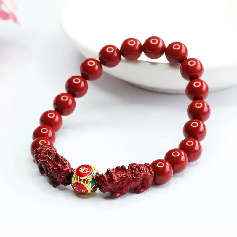 Close-up of a purple gold sand Cinnabar bracelet with carved Double Pixiu design, bead size 8mm.