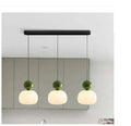 Nordic style pumpkin-shaped alloy chandelier with either one or three light heads in various colours.
