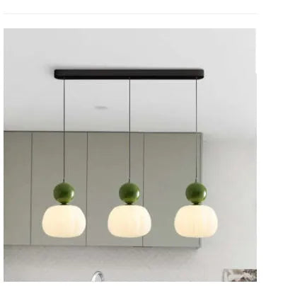 Nordic style pumpkin-shaped alloy chandelier with either one or three light heads in various colours.