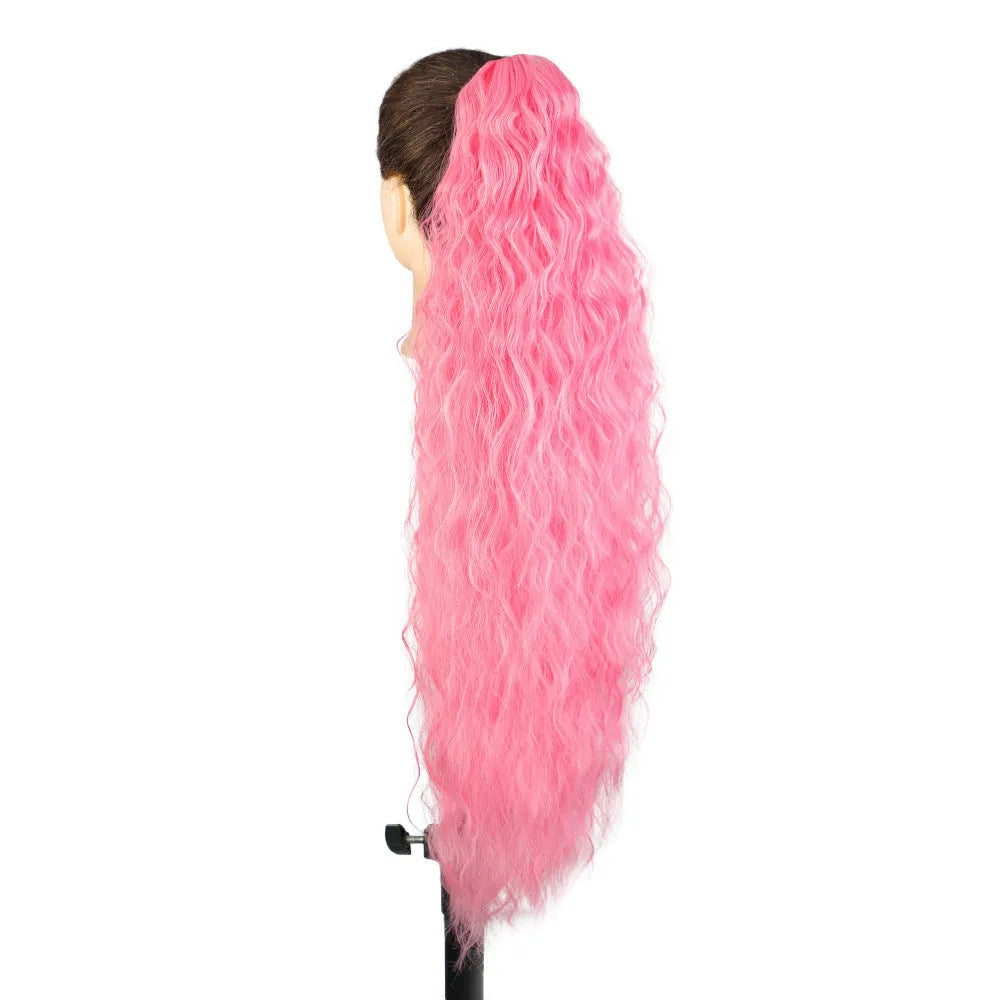 Long, fluffy curly synthetic ponytail wig in a high temperature fibre, shown in a 30-inch length.