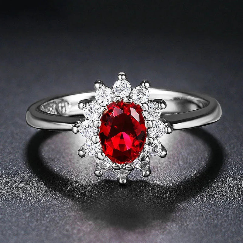 Women's blue moissanite and zirconium floral ring made from electroplated copper on a hand.