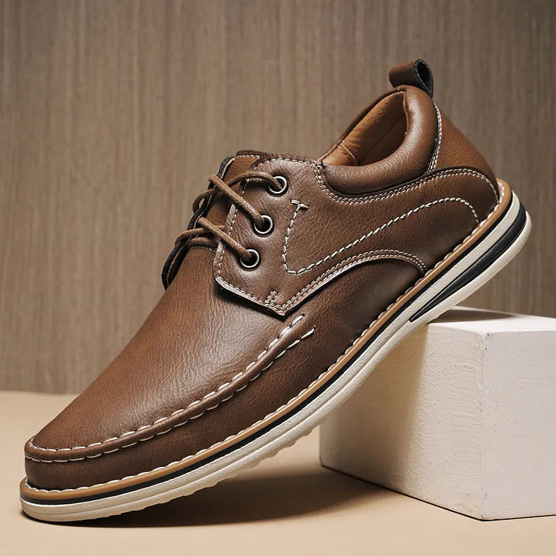 Men's black genuine leather casual lace-up shoes with round toe and low heel on a rubber sole.