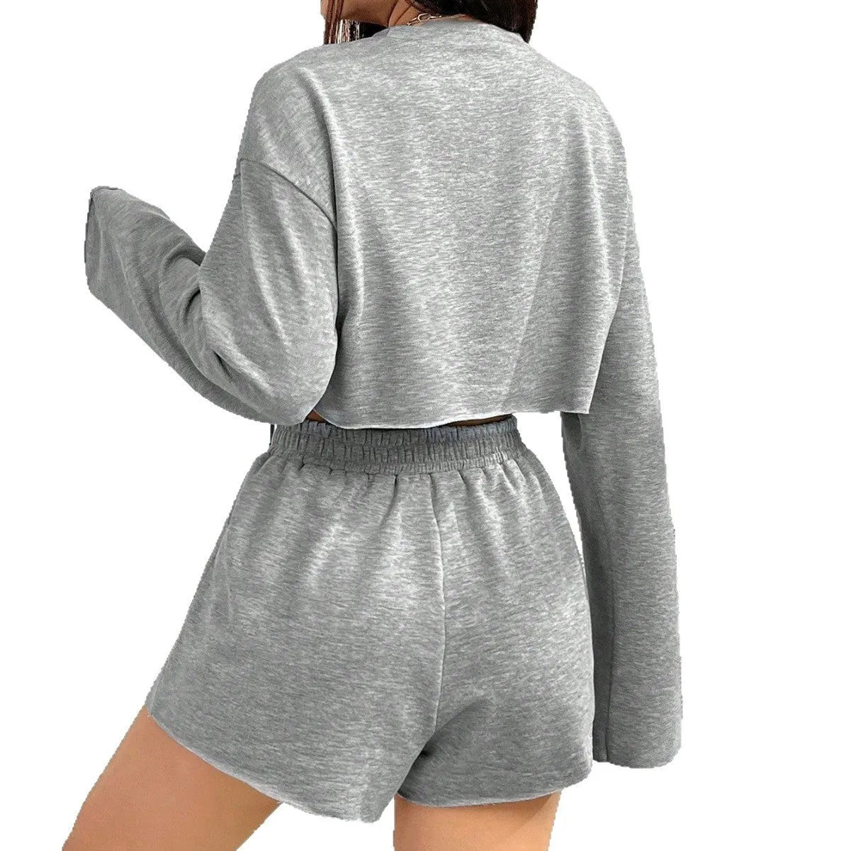 Grey women's long-sleeved T-shirt and matching shorts polyester suit set laid flat.