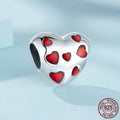 Red heart-shaped S925 sterling silver bead with glossy drip oil finish on plain background