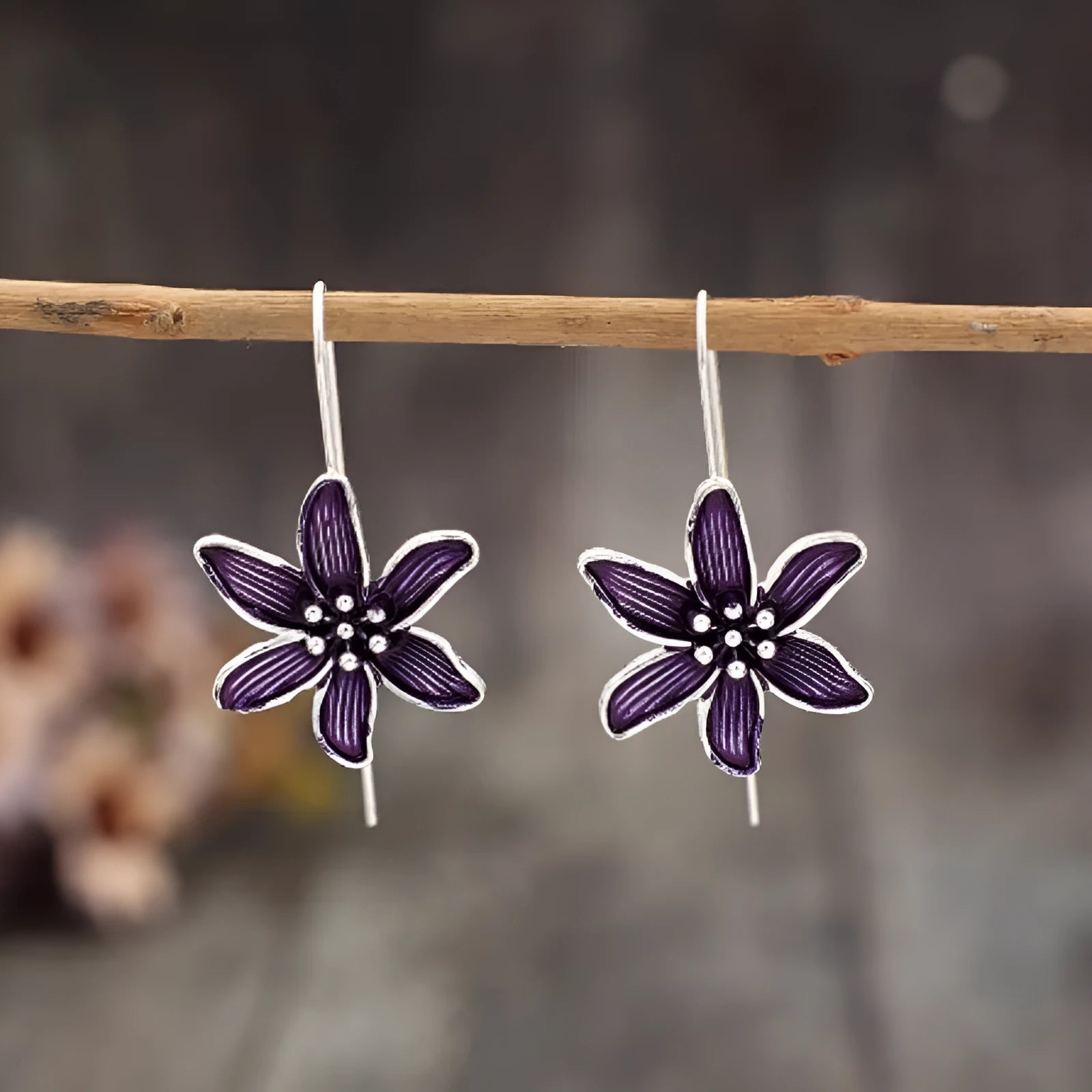 Purple flower-shaped alloy earrings with electroplated finish