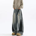 Men's blue distressed jeans with splash-ink patterns and rips in loose fit American style