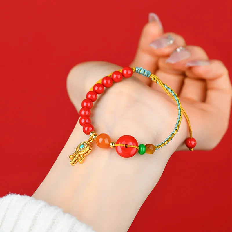Red cinnabar bracelet with hand-woven geometric peace buckle in national style