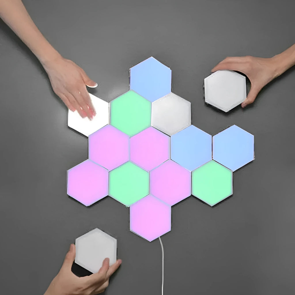 Close up of a modular hexagon LED wall light in a honeycomb pattern with multiple colour panels