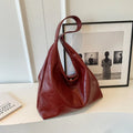 Soft leather shoulder bag with sandwich pocket exterior in multiple colour options