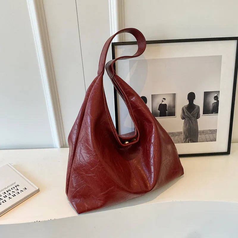 Soft leather shoulder bag with sandwich pocket exterior in multiple colour options