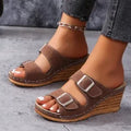 Women's wedge sandals with outer belt buckle in creamy-white colour on rubber sole