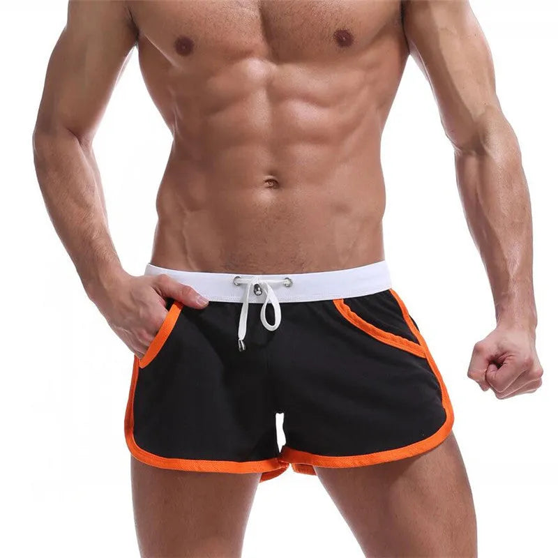 Summer men's quick-drying polyester beach sports shorts in green, with elastic waistband, front view