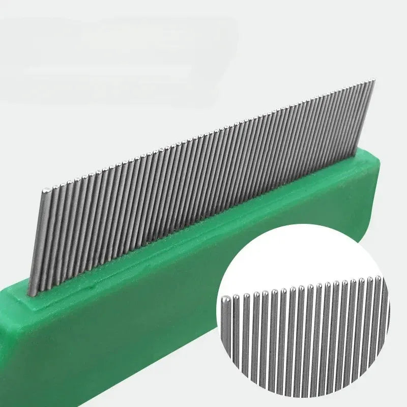 Green plastic-handled stainless steel pet flea comb for dog and cat grooming measuring 129mm