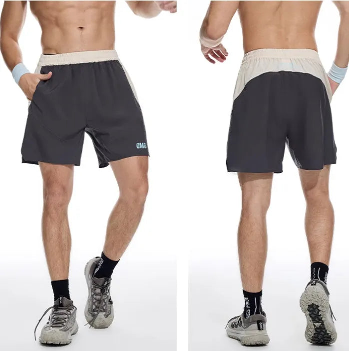 Men's loose fit workout shorts in dark rock ash colour with elastic waistband and lace-up front for gym training