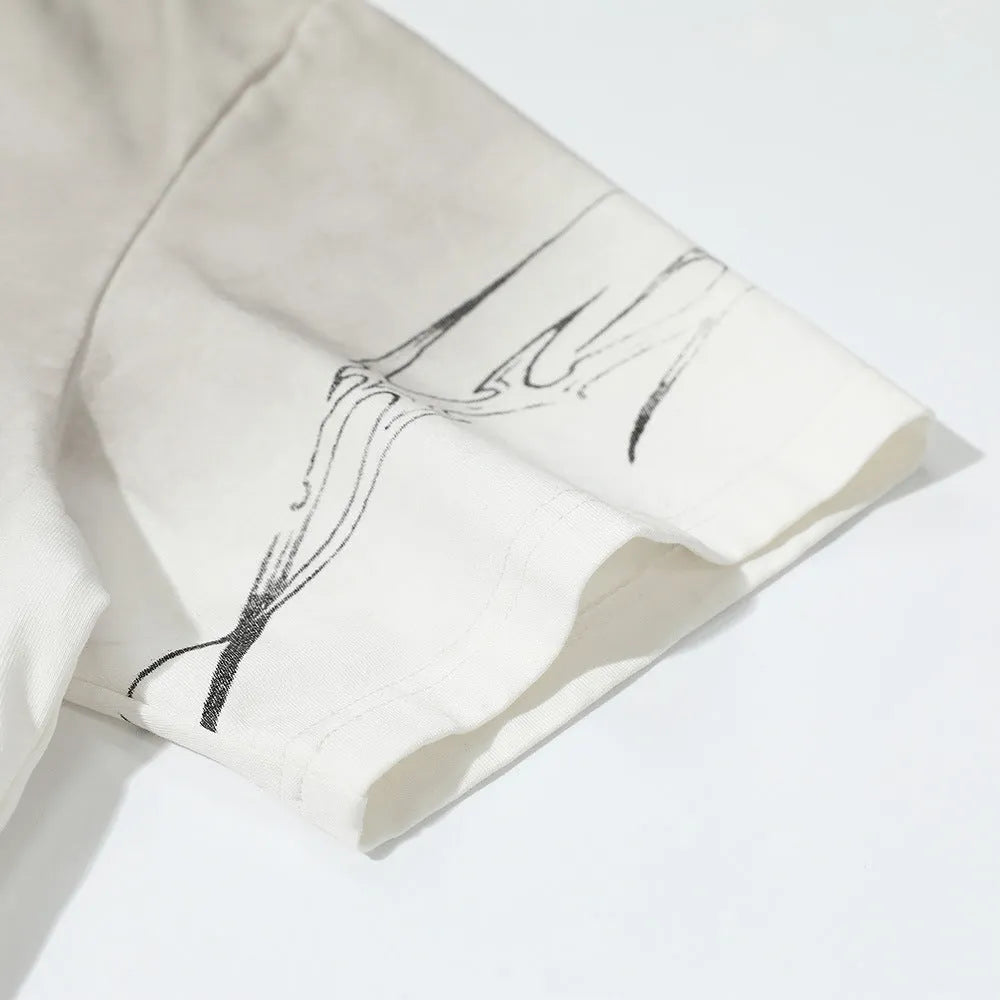Men's short-sleeved printed cotton T-shirt on a hanger, shown in white and black colour options.