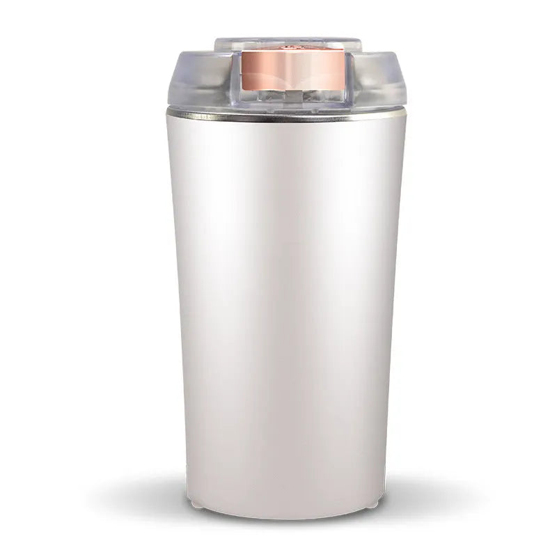Blue mini flour mill and grinder machine made from stainless steel with adjustment dial.