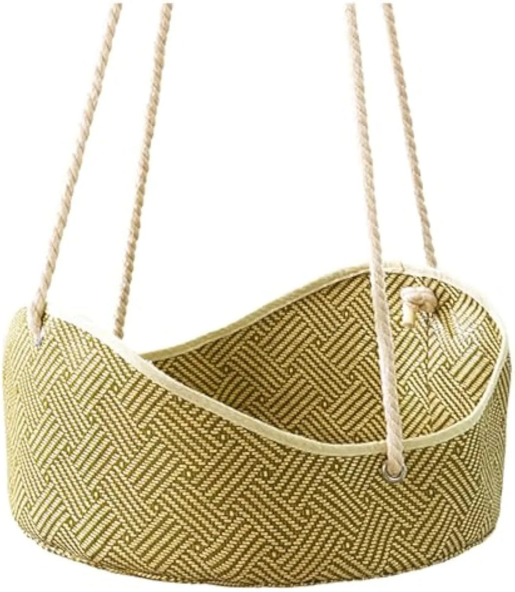 Green rattan cat hammock with metal hooks hanging from a shelf