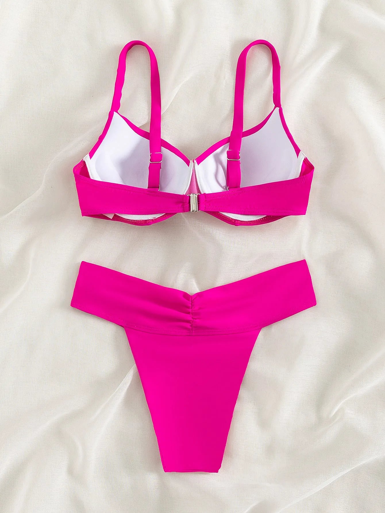 Women's solid colour bikini swimsuit in briefs style on a neutral background.