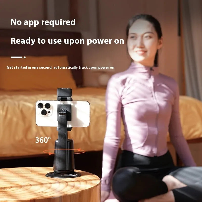 Black desktop camera bracket with face tracking, motorised rotation, and ribbon LED lighting for smartphones