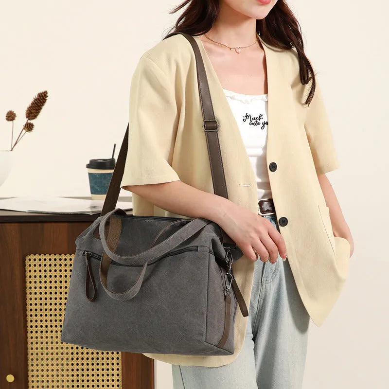 Women's retro style canvas shoulder bag in horizontal square shape with organisational compartments