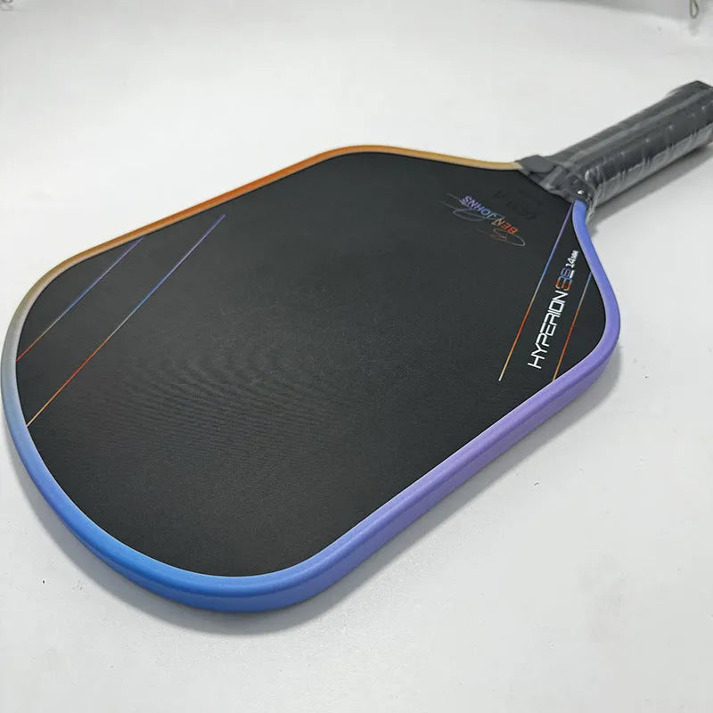 Colour pattern matte finish pickleball racket with T700 carbon fiber construction and honeycomb core.