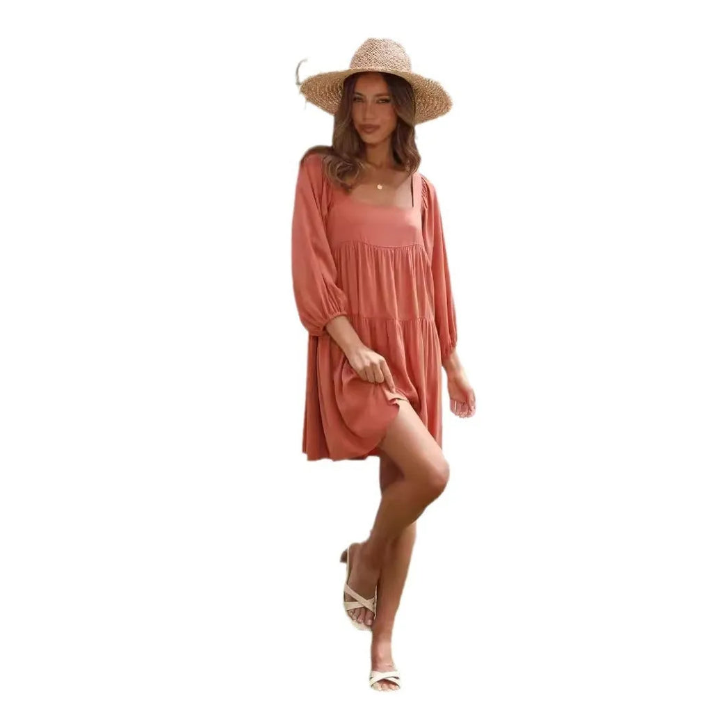 Light blue square collar puff sleeve backless A-line dress for a girl on a hanger.