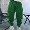 Men's blue bamboo fibre casual sports trousers with a loose, cropped fit on a neutral background.