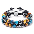 Handmade Tiger's Eye and alloy bracelet with auspicious elephant charms on wrist.