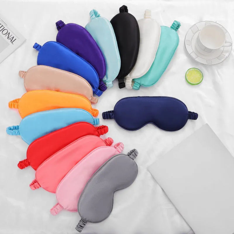 Rayon satin sleep mask in various colours showing double-sided silk-like fabric and elastic strap.