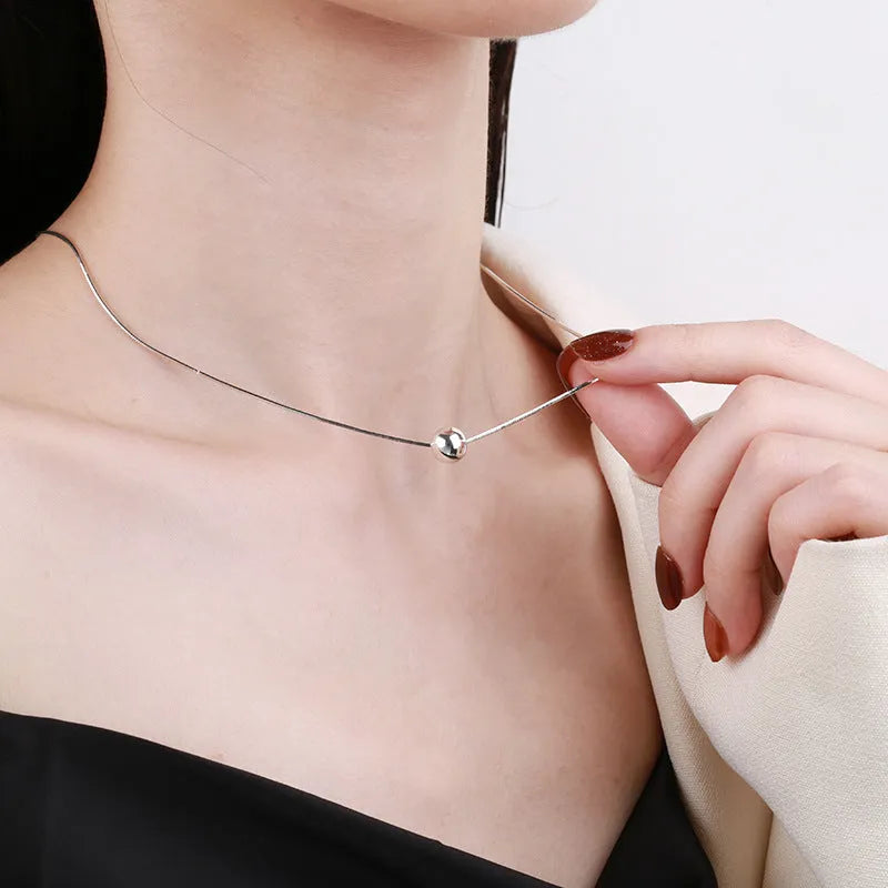 Small ball pendant on delicate 925 silver clavicle necklace with round YFL376 design