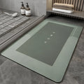 Baikal colour anti-slip bathroom floor mat in oval and rectangular shapes on tiled floor