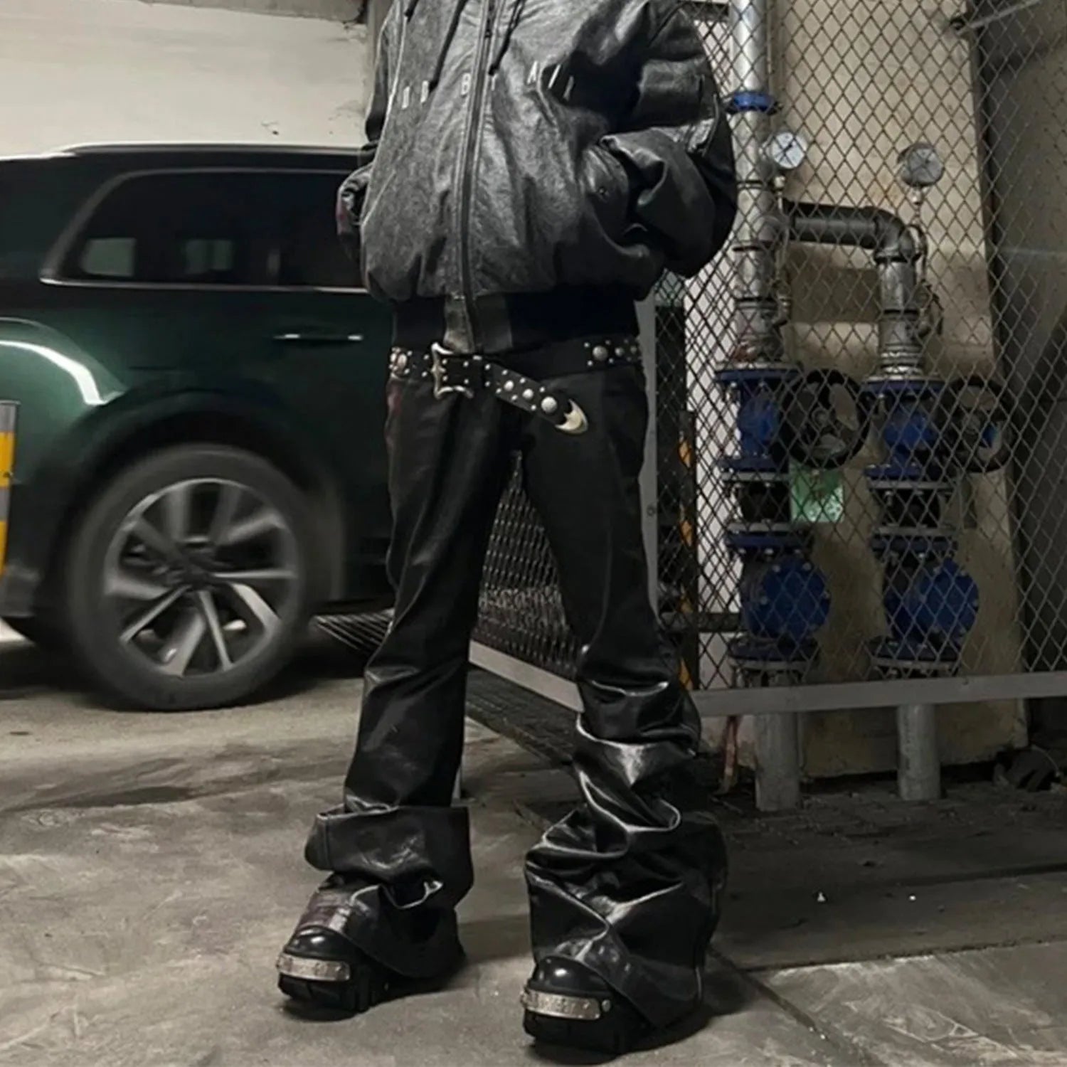 Black coated shiny patent leather skinny jeans with a straight leg and mid waist.