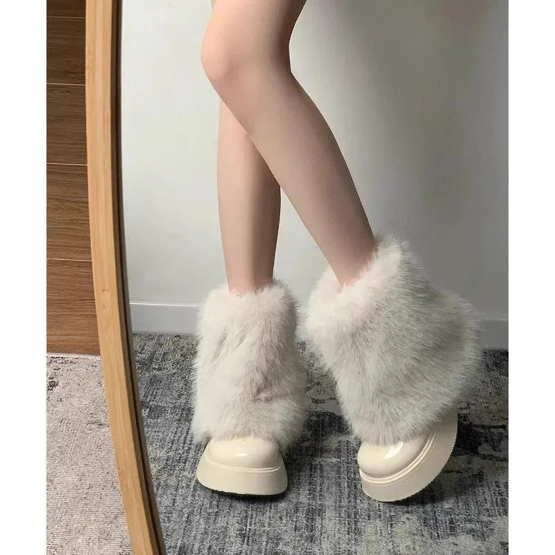 Women's black low-top snow boots with plush fleece lining and a waterproof rubber platform sole
