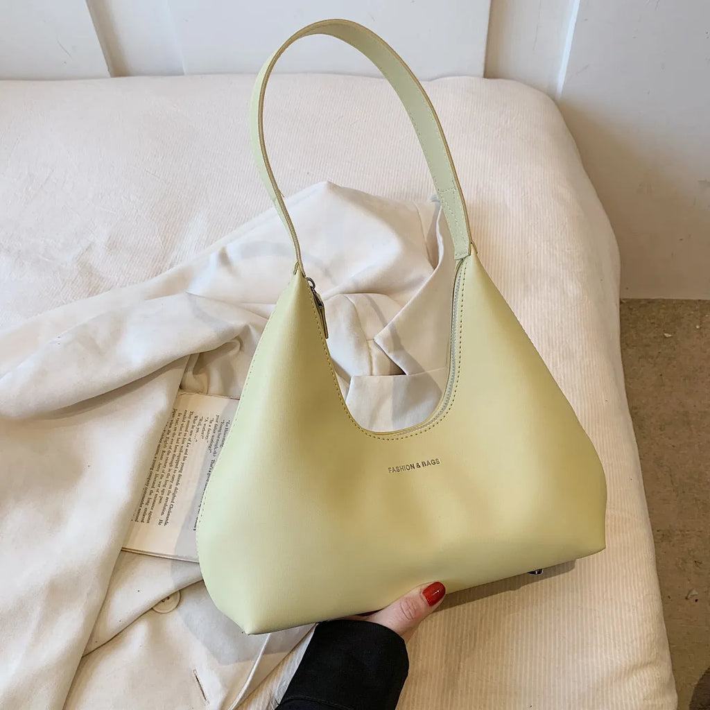 Women's retro pillow-shaped shoulder handbag in brown with sandwich pocket exterior and internal organisation