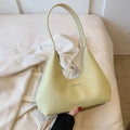 Women's retro pillow-shaped shoulder handbag in brown with sandwich pocket exterior and internal organisation