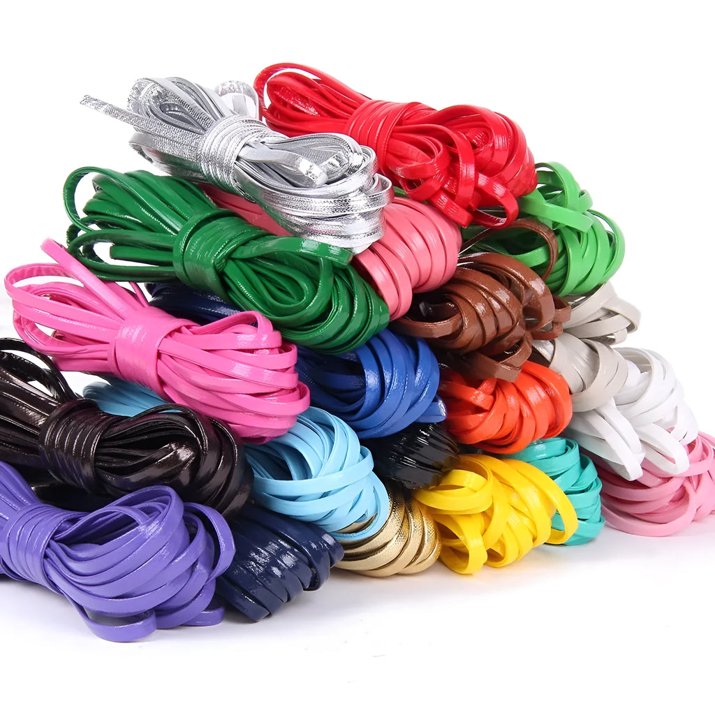Rolls of PU leather weaving cord in various colours and widths for DIY craft projects.