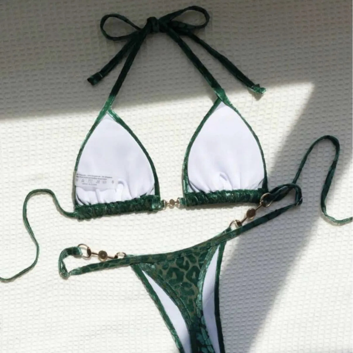 Blue leopard print women's swimsuit bikini set on a mannequin.