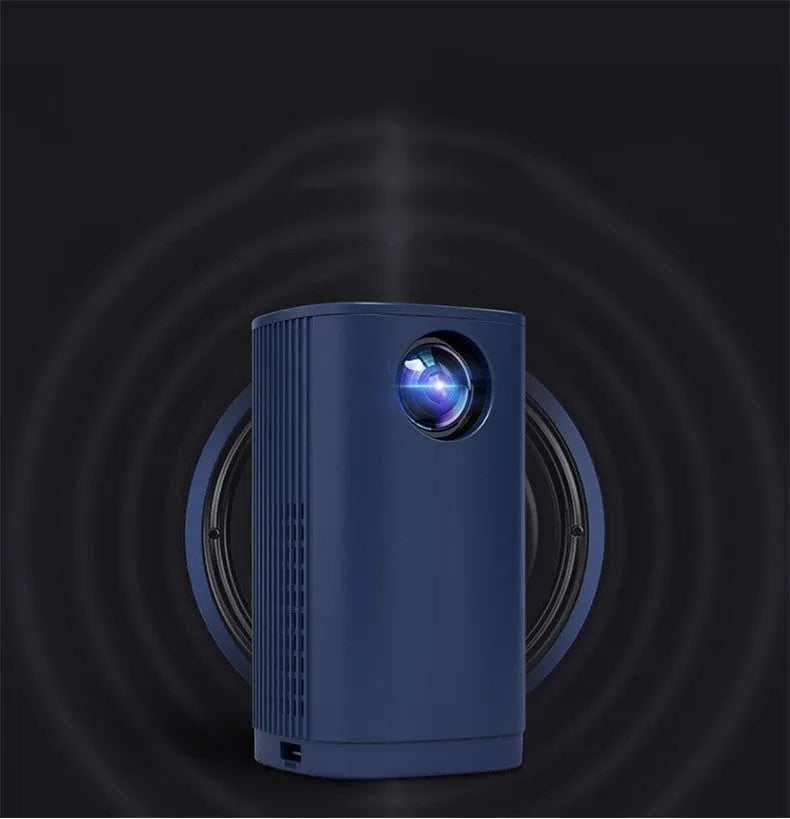 Blue mini projector with remote control on table showing movie projection on wall