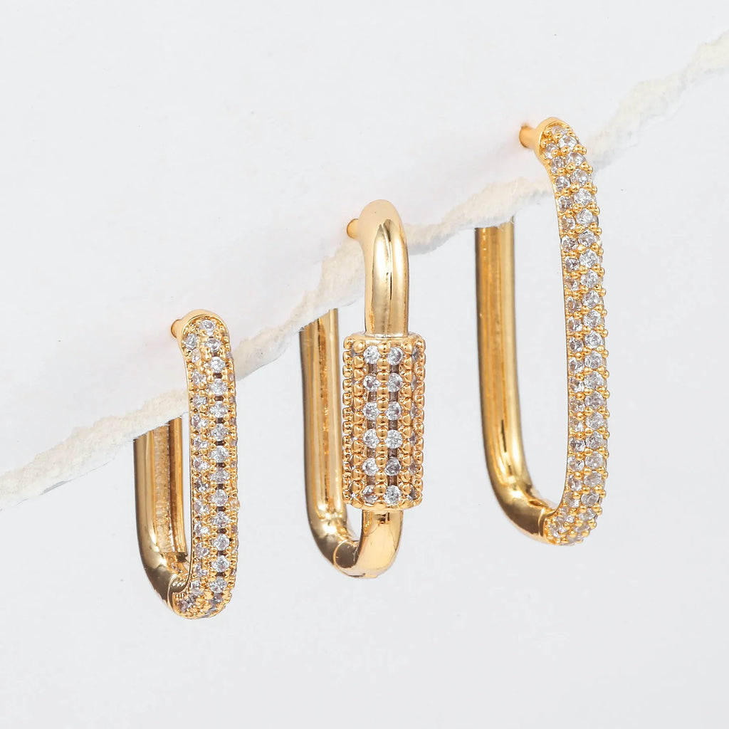 Geometric zircon ear clip set showing three square earrings with quadrilateral and ellipse designs