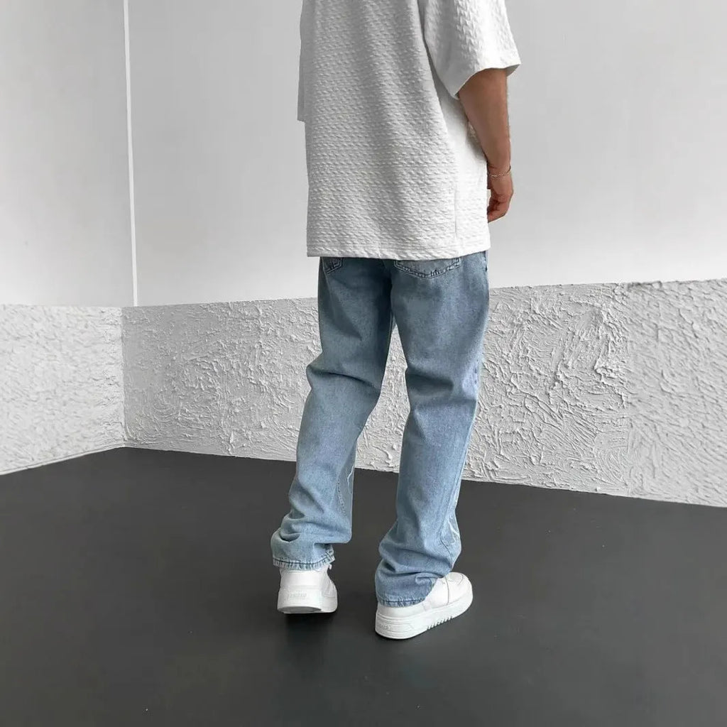 Men's blue straight-leg loose fit cotton denim jeans with mid waist design