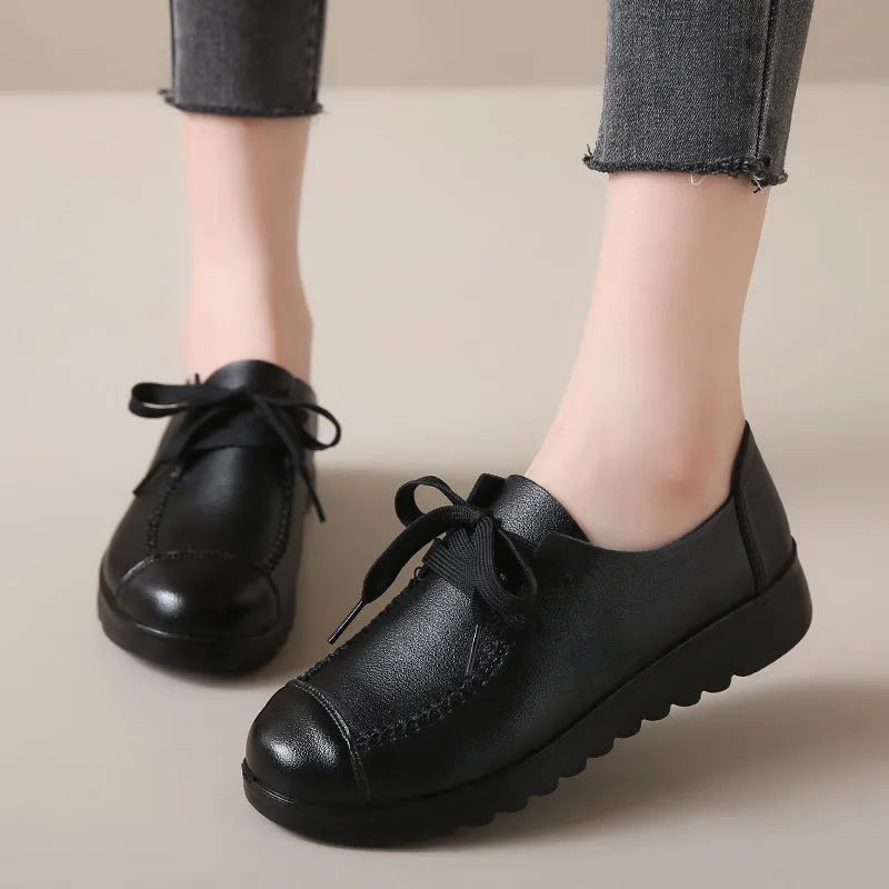 Women's work shoes in colour 6018 Black with round toe, front lacing, and anti-slip sole